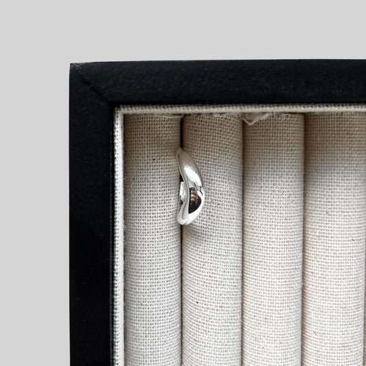 Contour Ring with smooth sterling silver curves, presented in a minimalist ring box, photographed from above – Ahrensandco.